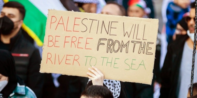 Palestine will be free from the river to the sea on a sign at a protest